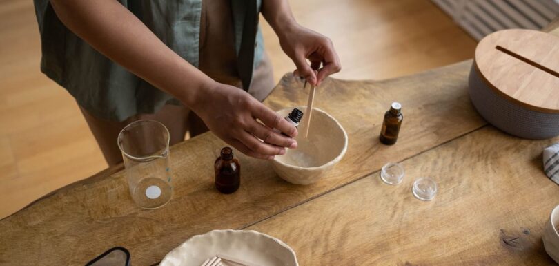 Small-batch producer preparing handmade cosmetics in a tidy home workshop