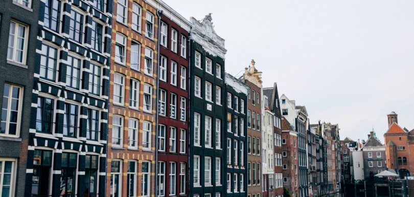 Traditional canal houses along an Amsterdam canal in the Netherlands, representing the Dutch market for cosmetic products