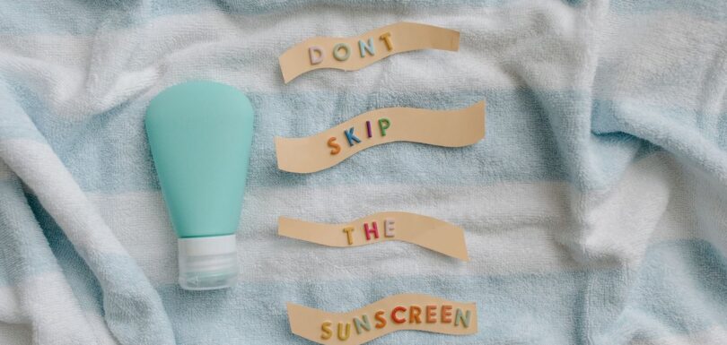 Sunscreen bottle with a reminder to apply sun protection