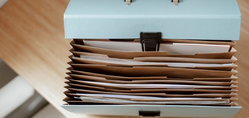 Business documents and folders representing CPSR, PIF and SDS paperwork