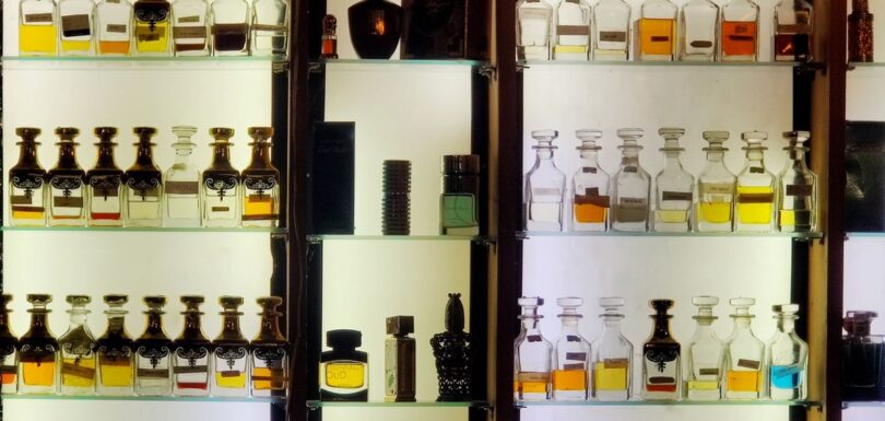 Shelves of fragrance bottles representing cosmetic fragrance allergens
