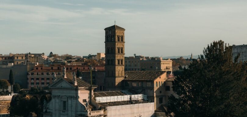 Rooftops and bell tower of historic Rome at golden hour
