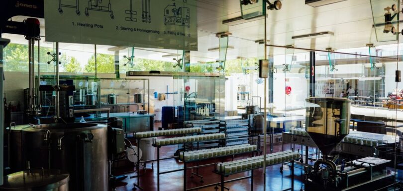 A cosmetics manufacturing line with filled containers